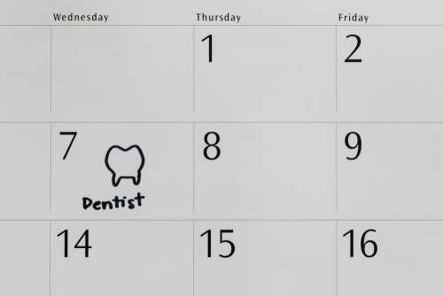 writing dentist on calendar